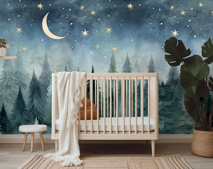 a baby crib in front of a night sky with stars and trees