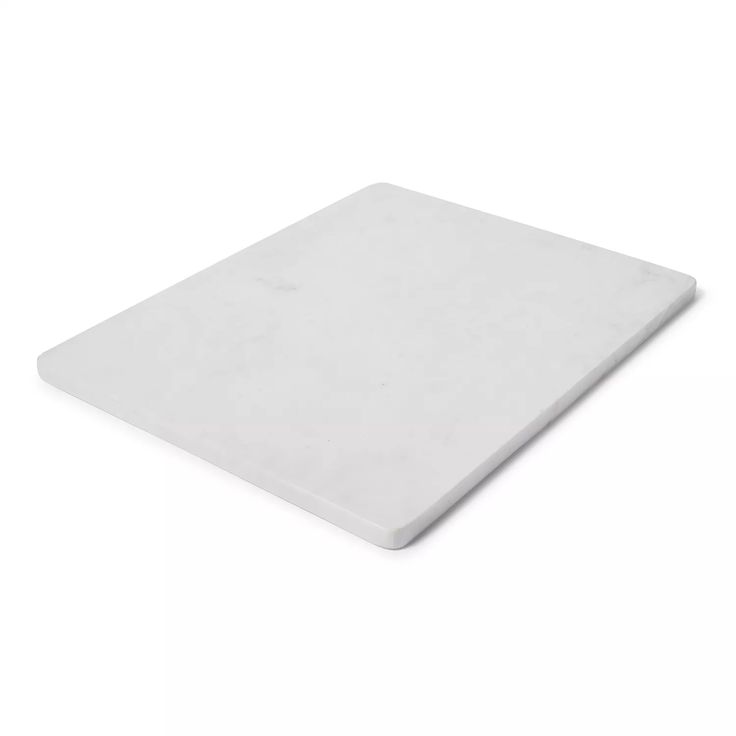 a white cutting board on a white background