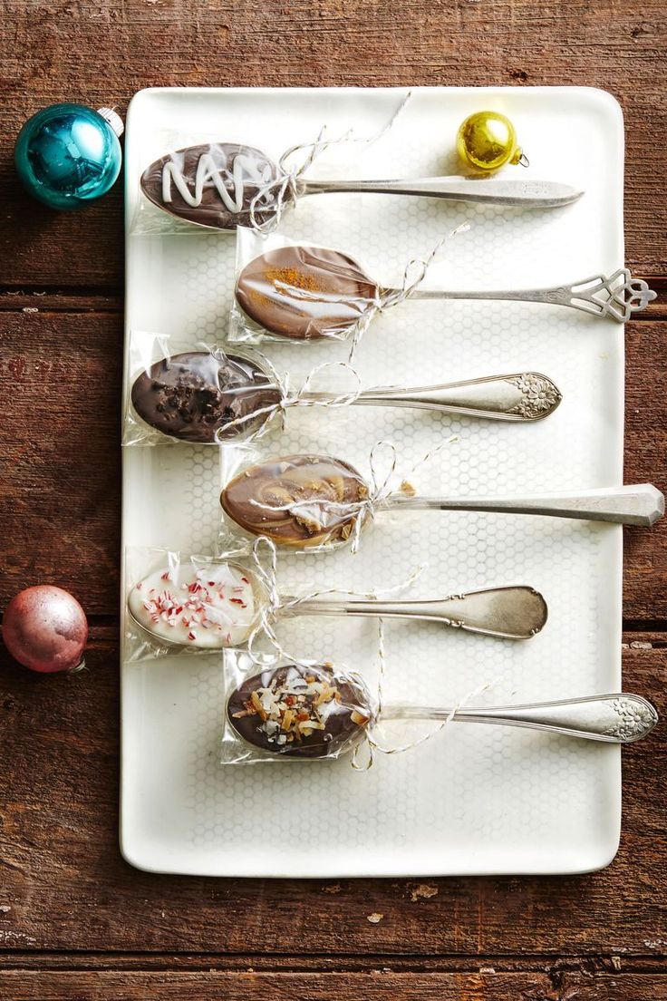 spoons are lined up on a white plate