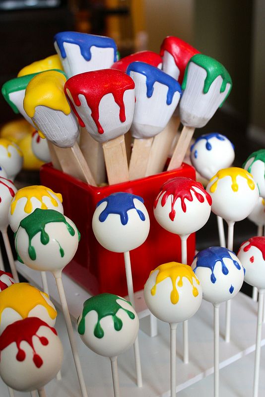 cake pops with colorful icing and wooden skewers