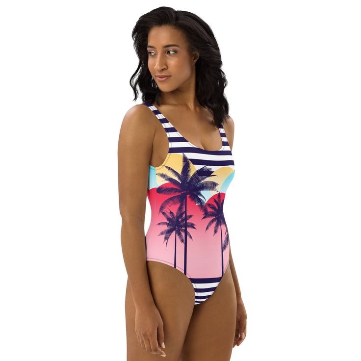 This one-piece swimsuit for all figures will bring out your best features. Enjoy the smooth fabric and the flattering design, and show it off by the sea or pool! • 82% Polyester, 18% Spandex• Chlorine-resistant fabric • Cheeky fit with a scoop neckline and a low scoop back • Zig-zag stitching • Double-layer front Tropical Swimwear For Pool With Lined Body, Tropical Style One-piece Swimsuit For Beach Season, Tropical Style One-piece Swimwear For Beach Season, Tropical Beach Bodysuit With Lined Body, Tropical Style Bodysuit For Beach Season, Tropical Bodysuit For Beach Season With Lined Body, Fitted Beachy One-piece For Vacation, Fitted Beachwear Bodysuit For Vacation, Fitted Bodysuit For Beach Party Vacation