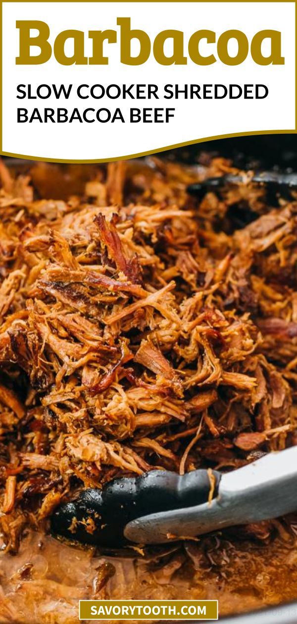 barbecue slow cooker shredded barbacoa beef in a pan with tongs