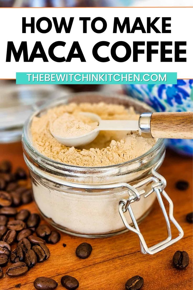 a jar filled with maca coffee sitting on top of a wooden table next to coffee beans