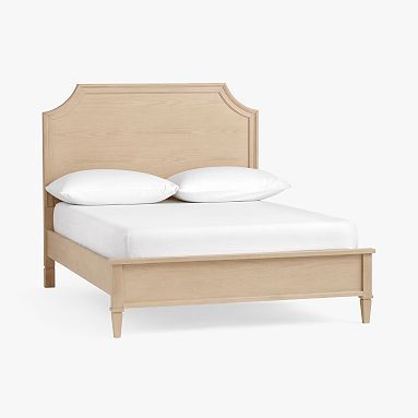 a bed with two pillows on top of it