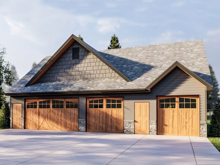 a two car garage is shown with three windows