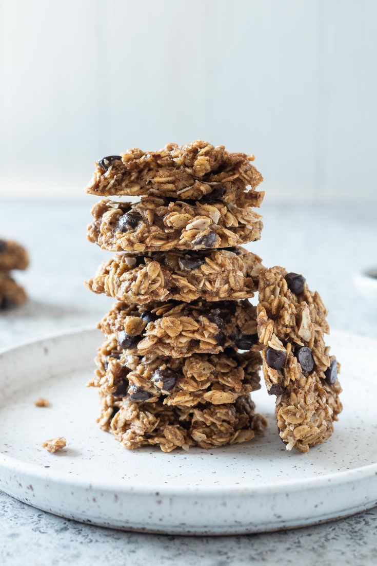 three cookies stacked on top of each other with chocolate chips and oatmeal