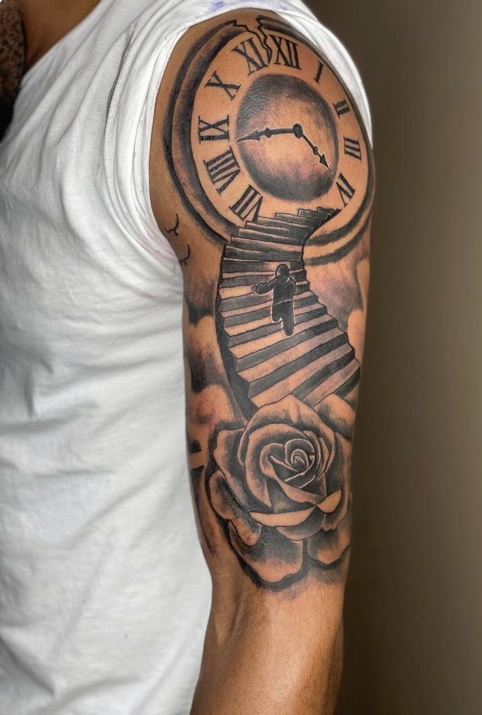 a man with a clock and rose tattoo on his arm