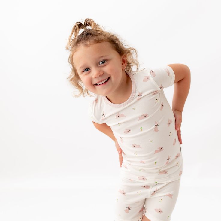 Our toddler pajama sets are breathable, super soft, and wildly comfy. Each set comes with a short-sleeved top and matching shorts made with luxurious, eco-friendly viscose from bamboo fabric for all-over comfort without the negative environmental impact. Wash before first use Machine wash cold, gentle cycle Tumble dry low Iron low if desired Do not bleach 95% Viscose from bamboo, 5% Spandex No tag for extra comfort Spring Short Sleeve Sleepwear Set, Fitted Short Sleeve Sleepwear For Pajama Party, Family Matching Sleep Pajama Sets With Short Sleeves, Matching Spring Loungewear Tops, Family Matching Sleep Sets With Short Sleeves, Spring Loungewear Matching Tops, Playful Fitted Short Sleeve Sleepwear, Playful Matching Set Top For Pajama Party, Playful Short Sleeve Sleepwear For Playtime