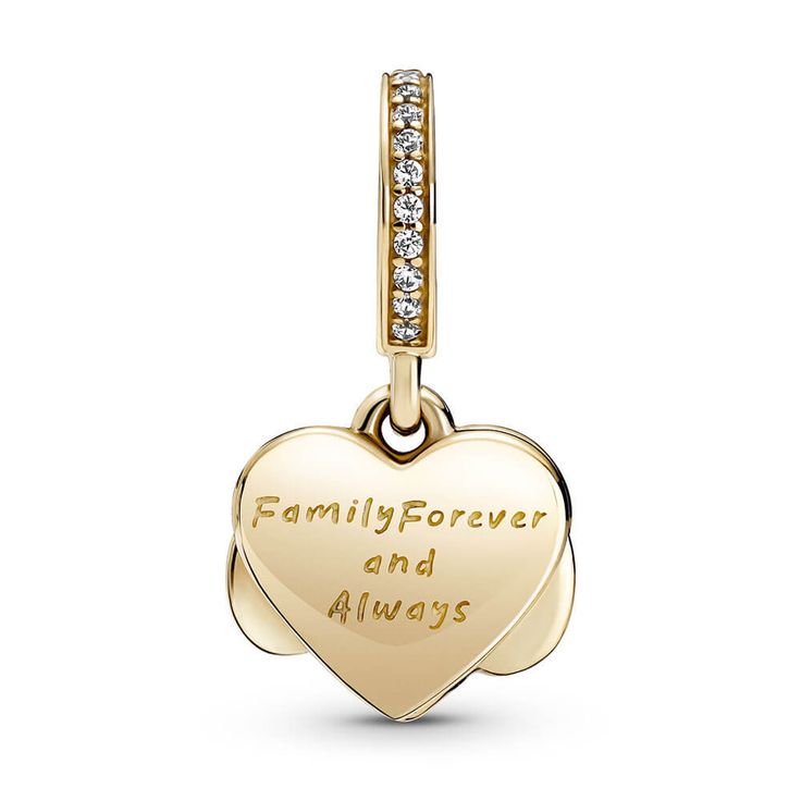 Take your love to new heights with the Sparkling Infinity Heart Dangle Charm. The front dangle is hand-finished in 14k gold and features an infinity symbol wrapped around a sparkling heart set with clear cubic zirconia. The back dangle is decorated with hand-applied shimmering silver enamel to provide the perfect backdrop and includes the love-filled engraving “Family forever and always." Gift this detailed charm to your loved one as a reminder of your close bond. Dangling Charms Jewelry For Valentine's Anniversary, Valentine's Day Anniversary Jewelry With Dangling Charms, Heart Charm Dangle Charms For Anniversary, Heart Dangle Charms For Anniversary, Elegant Charms For Anniversary And Mother's Day, Anniversary Heart Dangle Charms, Elegant 14k Gold Heart Charm, Anniversary Jewelry In Yellow Gold With Removable Charms, Anniversary Yellow Gold Jewelry With Removable Charms