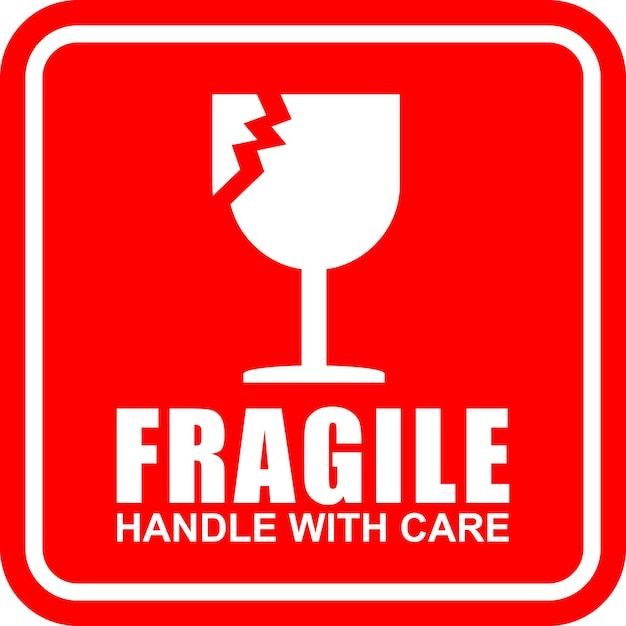 fragile handle with care sign in red and white