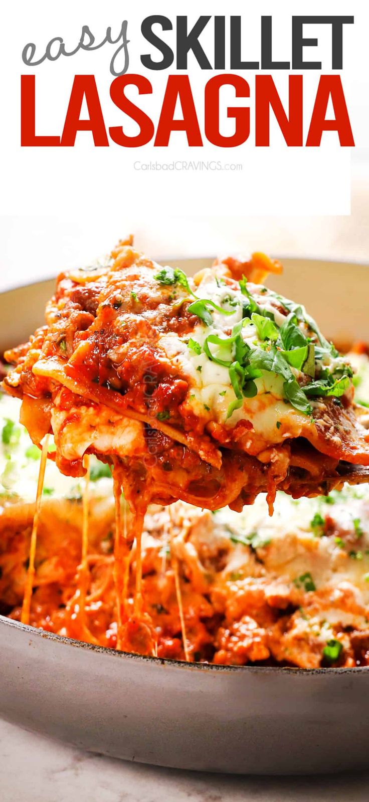 a skillet filled with lasagna covered in sauce and cheese