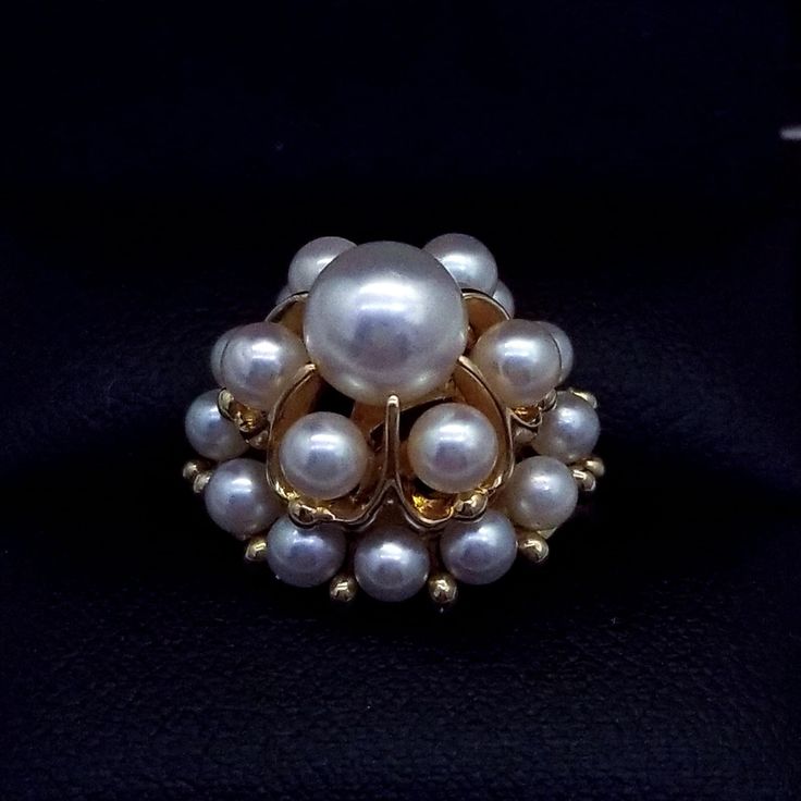 Vintage Mikimoto 14k Gold Pearl Cluster Cocktail Ring Beautiful detailed Cocktail Cluster Ring, set with 19 Mikimoto Pearls, each measuring approx. 3.4-7mm. Table Dimension is approximately 19mm x 19mm Hand crafted in 14 Karat Yellow Gold. The ring epitomizes vintage charm, taking you from day to evening effortlessly. Comes with lacquered wood box Ring Condition is excellent.- Very clean surface, no marks or scratches visible Pearl Condition is excellent - Round with an excellent luster. No mark White Cluster Ring Stamped 14k, White 14k Stamped Cluster Ring, Classic White Cluster Ring Hallmarked, Classic White Hallmarked Cluster Ring, Timeless Gold Cluster Jewelry, Vintage Gold Jewelry Aaa Quality, Fine Jewelry Yellow Gold Cluster Jewelry, Timeless High Luster Jewelry For Anniversary, Timeless Aaa Quality Jewelry For Anniversary