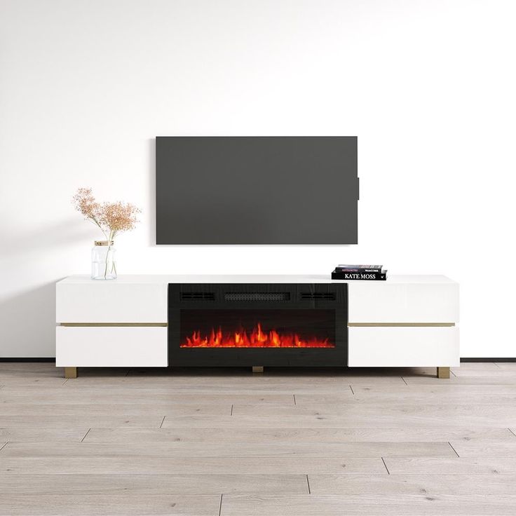 a television stand with a fire in the fireplace