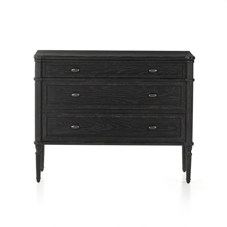 a black dresser with three drawers on it