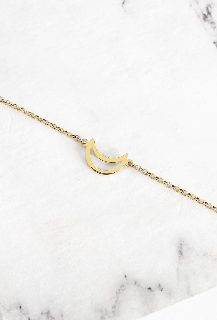 14K 9K Crescent Moon Bracelet, Half moon gold bracelet, Minimallist Dainty gold bracelet, Women Gift, Gift for Daughter, Birthday Gift, Gift for her, FREE EXPRESS SHIPPING Beautiful and delicate bracelet with a crescent moon charm made in 14K or 9K solid gold. Remember to reach for the moon and the stars, and they won't be able to resist flying into your hands! Whsiper...To the moon and back! -------------------------------------------------- D E T A I L S 14K Solid Gold or 9K Solid Gold Dimensi Dainty Crescent Bracelet As Gift, Dainty Crescent Bracelet For Gift, Minimalist Moon Phase Bracelet As Gift, Minimalist Moon Phase Bracelet Gift, Dainty Moon Shaped Bracelets As Gift, Minimalist Bracelets With Moon Charm As Gift, Elegant Gold Bracelets With Moon Phase, Minimalist Bracelet With Moon Charm As Gift, Minimalist Moon Phase Bracelet