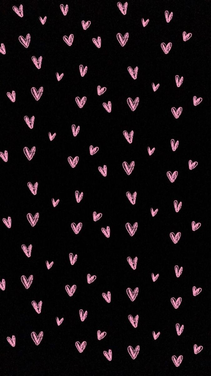 pink hearts are drawn on black paper