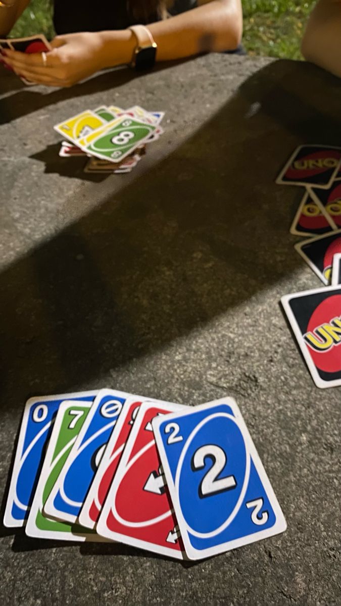 several playing cards are laying on the ground