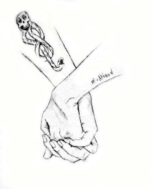 two hands holding each other with tattoos on their fingers and the words i believe in