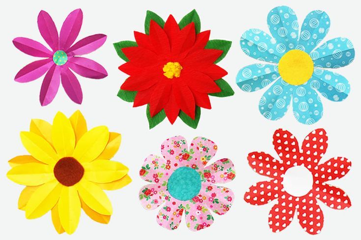 four different types of paper flowers on a white background