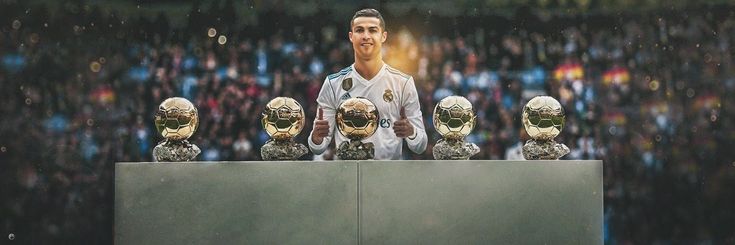 a man standing in front of a group of soccer balls on top of a table