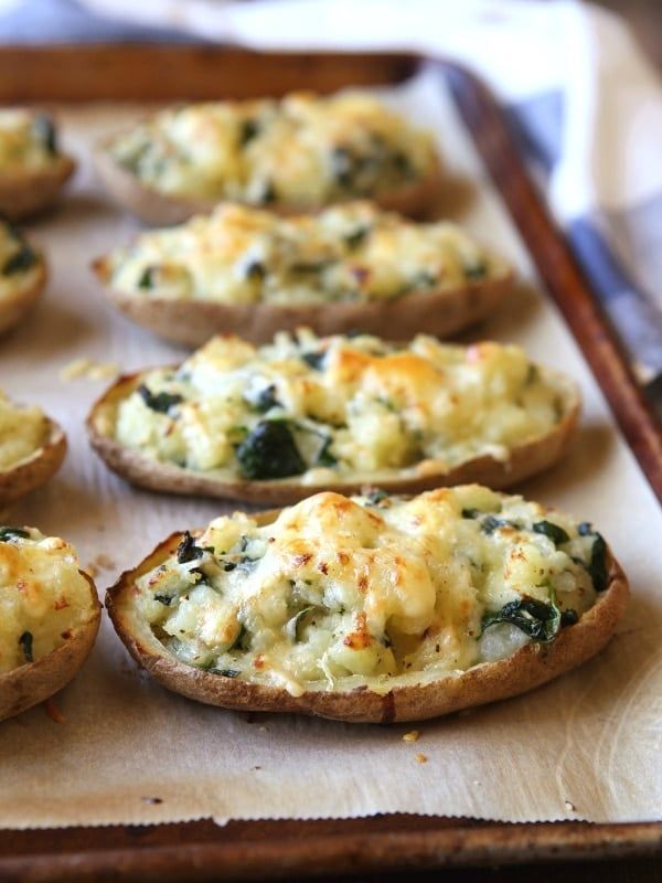 baked bread with spinach and cheese on a baking sheet