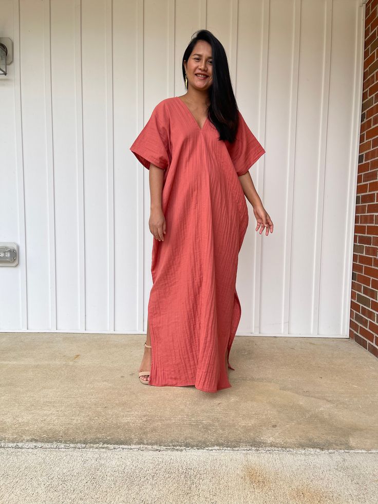 Embrace the gentle waves and sunny shores with our double gauze cotton kaftan. This versatile caftan falls gracefully between the knees or ankles, depending on the length you choose. It's the ultimate in loungewear for women - perfect as a beach dress or cover up. Crafted from light and airy double gauze cotton, it's your essential for a night on the town, a day by the sea, or just running errands. Casual V-neck Kaftan For Daywear, Cotton Maxi Dress With Relaxed Fit, Unlined, Unlined Summer Maxi Dress For Loungewear, Relaxed Fit Cotton Maxi Dress Unlined, Casual Maxi Dress For Beach Season Loungewear, Casual V-neck Relaxed Fit Kaftan, Summer Maxi Dress With Relaxed Fit For Loungewear, Breezy Relaxed Fit Maxi Dress For Daywear, Summer Cotton Gauze Loungewear Dress