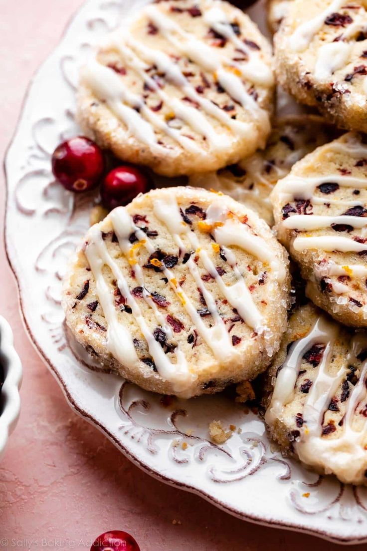 cranberry orange icebox cookies on a plate with the title overlay reads, cranberry orange icebox cookies