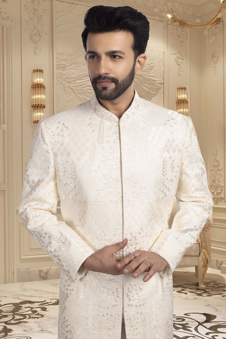 Introducing our Mens Sherwani R14-S57, the epitome of elegance. Adorned with delicate thread embroidery, this sherwani is perfect for a groom looking for a sophisticated and luxurious outfit. Elevate your wedding day with this exquisite thread work sherwani. Elegant Cream Bandhgala With Chikankari Embroidery, Festive Nehru Jacket With Intricate Embroidery For Groom, Eid Nehru Jacket With Intricate Embroidery For Groom, Traditional Nehru Jacket With Chikankari Embroidery For Groom, Groom's Eid Sherwani With Chikankari Embroidery, Festive Nehru Jacket With Chikankari Embroidery For Groom, Formal Long Sleeve Sherwani With Chikankari Embroidery, Elegant Bandhgala With Chikankari Embroidery For Groom, Elegant Embroidered Sherwani For Groom