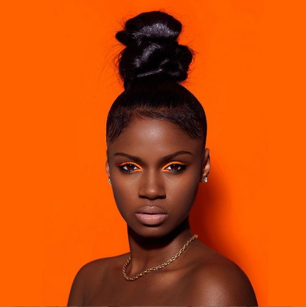 Melanin x Color: NY Photographer Poses Black Women Against Colored Backdrops for Stunning Photo Series Lifestyle Fashion Photography, Knot Bun, African Queen, Beauty Portrait, Dark Skin Makeup, Orange Is The New Black, American Woman, Orange Background, Brown Girl