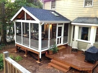 a small house with a deck and covered patio