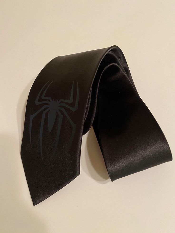 Classic Adult Necktie If you would like a different color symbol -just message me Black on Black is perfect for a customer service or office job that request not too bright color ties Red, Blue, White, etc... symbol available Black Suit And Tie Accessories For Father's Day, Black Suit And Tie Accessories For Father's Day Gift, All Black With Red Tie, Black Ties For Office, Adjustable Black Tie For Office, Black Fitted Suit And Tie Accessories For Father's Day, Black Tie For Party And Father's Day, Black Tie For Party On Father's Day, Adjustable Black Ties As Gifts