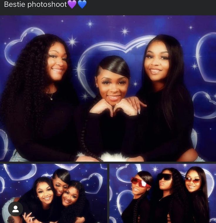 three women posing for a photo in front of a heart - shaped backdrop with stars