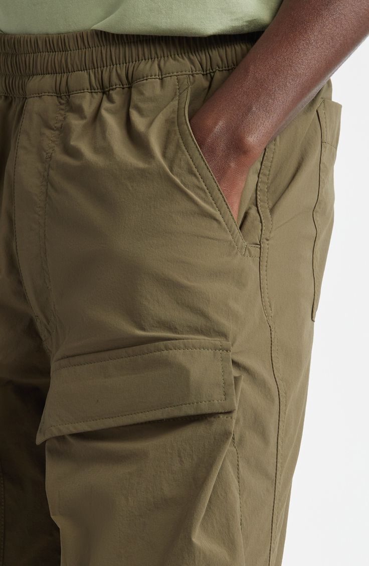 An ideal blend of function and fashion, these cargo shorts feature an elasticized waist, capacious pockets and a knee-grazing Bermuda silhouette. 10 1/2" inseam; 24" leg opening; 12" front rise; 17 1/2" back rise (size 50EU) Elastic waist Front scoop pockets; back button-welt pockets; cargo flap-patch pockets 85% polyamide, 15% elastane Hand wash, dry flat Made in Portugal Designer Clothing Functional Short Cargo Pants For Hiking, Short Hiking Cargo Pants With Functional Pockets, Short Cargo Pants For Hiking With Functional Pockets, Short Cargo Pants For Hiking, Utility Short Cargo Pants For Hiking, Short Cargo Pants For Outdoor, Khaki Utility Cargo Shorts, Khaki Bermuda Bottoms With Pockets, Functional Cargo Shorts With Cargo Pockets