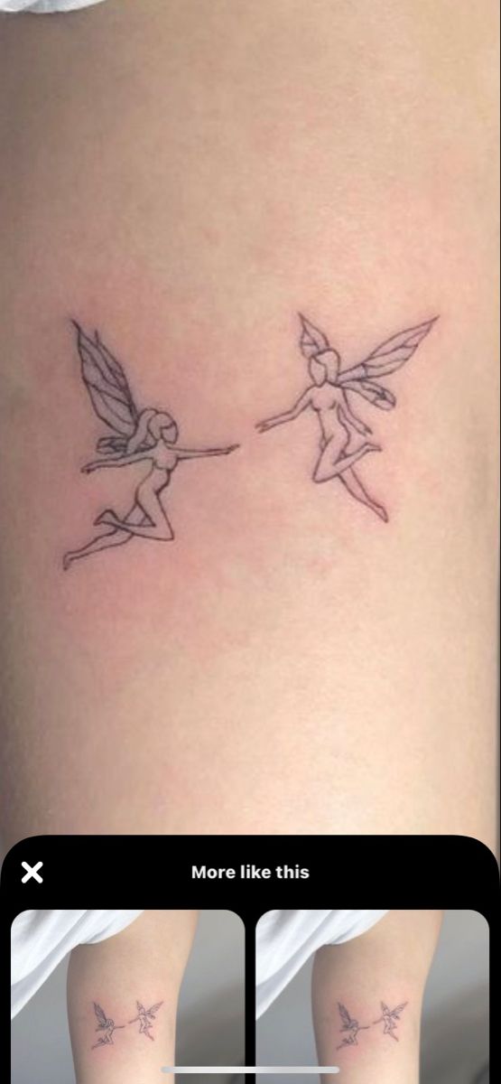 two small fairy tattoos on the side of a woman's thigh, one is being pulled