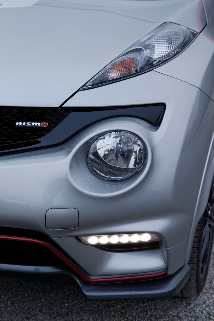 the front end of a silver sports car