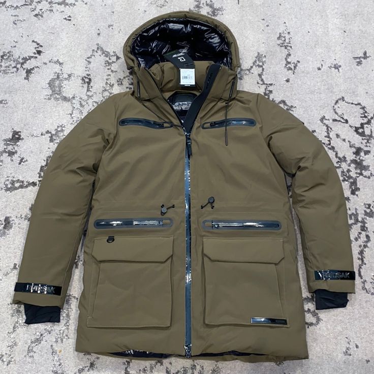 Army Green Luxury Winter Travel Outerwear, Designer Green Winter Outerwear, Utility Winter Parka For Travel, Utility Parka For Winter Travel, Designer Fitted Outerwear For Outdoor, Designer Fitted Outdoor Outerwear, Luxury Zipper Closure Outerwear For Outdoor, Luxury Outdoor Outerwear With Zipper Closure, Luxury Outdoor Outerwear With Zipper