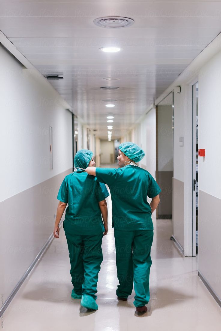 two doctors walking down a hospital hallway together by luma studio for stocks on artfire