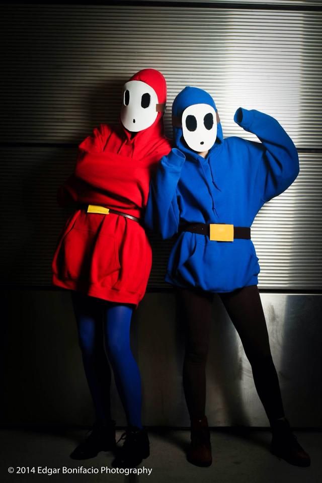 two people in costumes posing for a photo