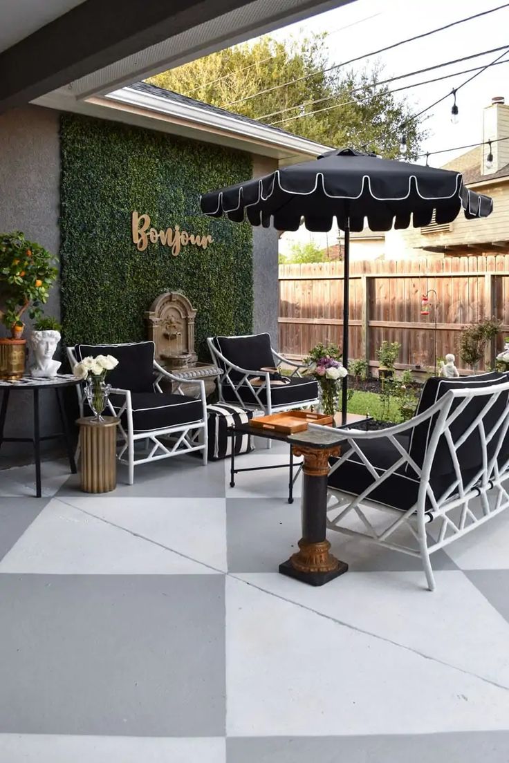 an outdoor patio with black and white checkered flooring