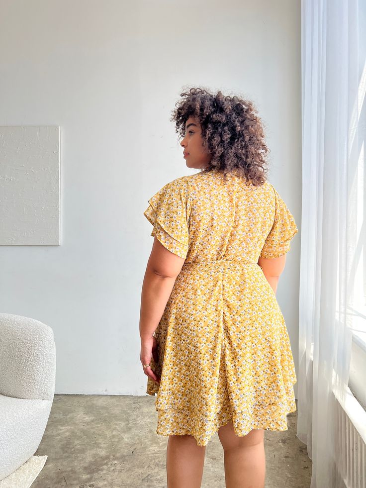 The Plus Size Daisies Belted Sundress is fluttery and flattering, an ideal dress for heading out to brunch or throwing on for some summertime errands. Wear this plus size dress with a pair of sandals for an everyday look or dress it up with a cute handbag, a cardigan, and some strappy heels. This dress features flutter sleeves, a v-shaped, surpliced neckline, a removable tie belt, a zipper up the back, and a flattering fit-and-flare silhouette. The material is a partially-lined, non-stretchy chi Cute Handbag, Cute Handbags, Guest Outfit, Flutter Sleeves, Plus Size Dress, Plus Size Casual, Wedding Guest Outfit, Tie Belt, Strappy Heels