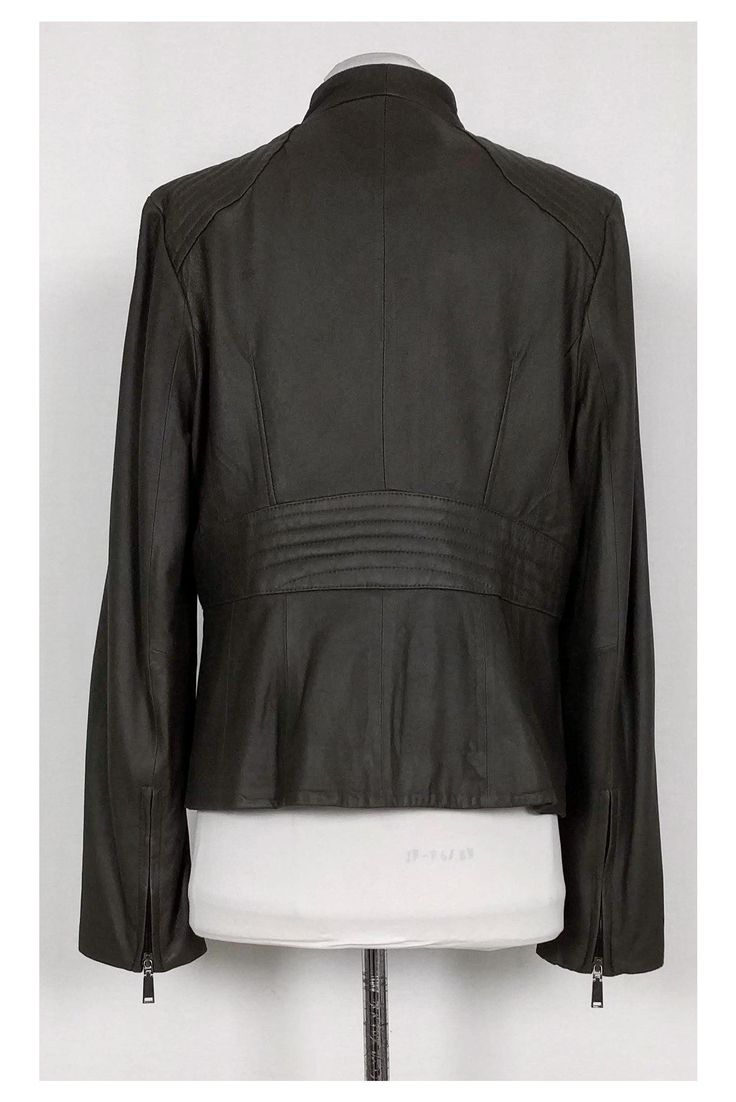 This grey asymmetrical jacket by Elie Tahari is definitely a closet staple. You can wear this jacket year-long for an effortless chic look. Easily pair this jacket with sweater dresses and stylish blouses for versatility. Size L Shell: 100% Genuine Leather Lining: 59% Cotton, 39% Polyester, 2% Spandex Concealed front zipper Two front zipper pockets Zippers on sleeves Quilted details Fold-over front Lined Some wear on hem Bust 41" Waist 37" Shoulder to hem 24" Modern Fitted Outerwear For Layering, Modern Fitted Fall Outerwear, Chic Asymmetrical Winter Blazer, Versatile Fitted Blazer For Layering, Versatile Fitted Fall Blazer, Sleek Outerwear For Layering In Fall, Sleek Outerwear For Fall Layering, Sleek Fall Outerwear For Layering, Chic Asymmetrical Fall Blazer