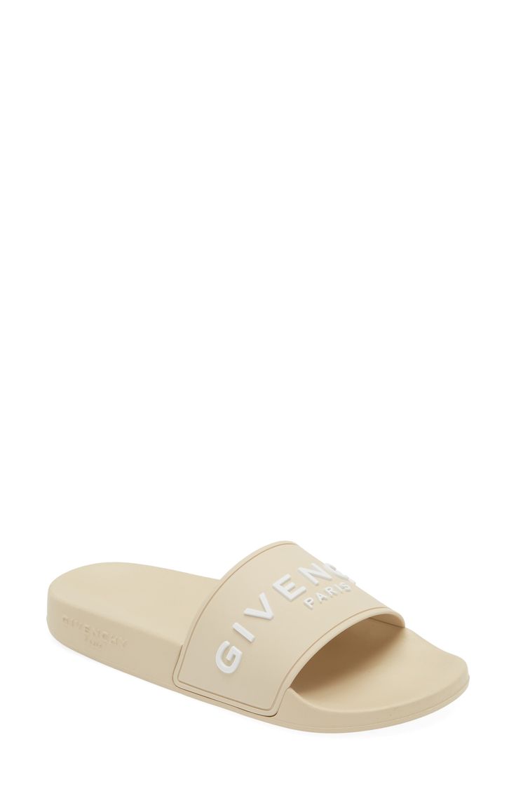 A bold Givenchy logo stamp crosses the wide strap of cushy, water-friendly sliders. Synthetic upper, lining and sole Made in Italy Women's Designer Shoes Luxury Spring Slides, Logo Open Toe Sandals For Summer, Luxury Summer Sandals With Logo, Designer Beach Slides With Cushioned Footbed, Designer Slides With Branded Insole For Beach, Designer Beach Slides With Branded Insole, Summer Slide Sandals With Logo Print, Summer Slide Sandals With Logo, Summer Open Toe Sandals With Logo Print