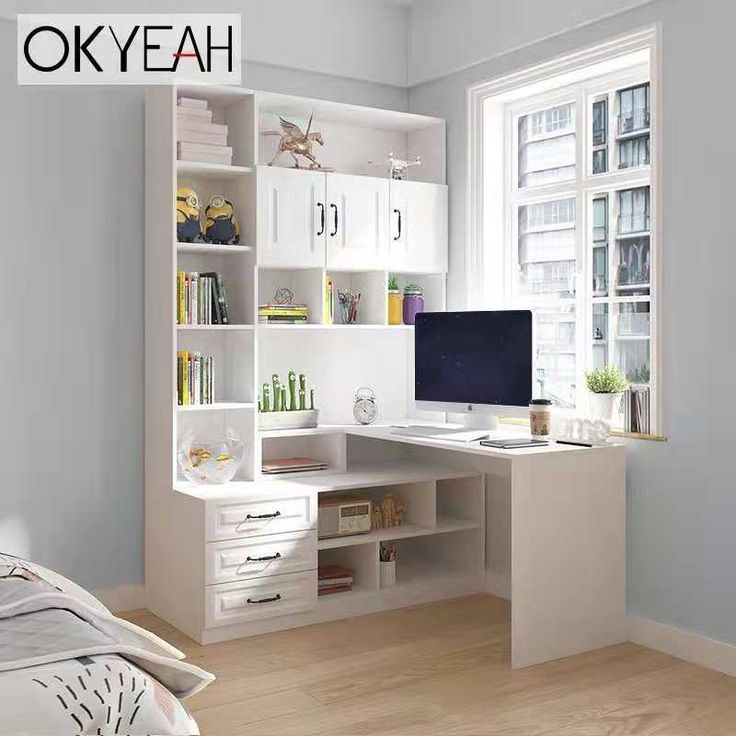 a bedroom with a desk, bookshelf and computer on the table in front of a window