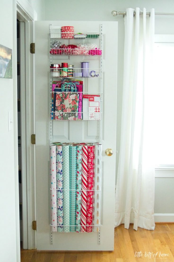 the door is open to reveal an organized craft room