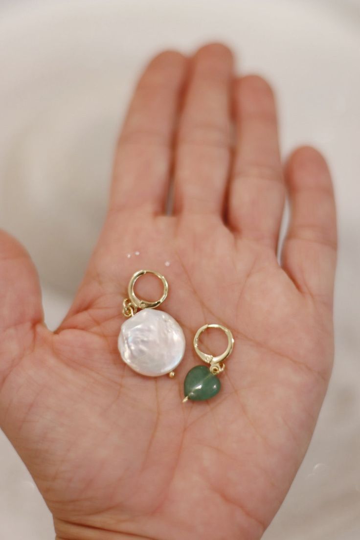 A gorgeous pair of earrings featuring a jade heart, meant to be worn on the left ear, a connection to your heart chakra. And the pearl as a reminder to follow the right track, and your inner wisdom. These mismatched earrings are the perfect pair, because who said we have to wear two of the same all the time? Green Drop Earrings With Pearl Charm, Jade Pearl Drop Earrings As Gift, Elegant Green Earrings With Heart Charm, Pearl Earrings With Natural Stones As A Gift, Heart-shaped Pearl Charm Earrings For Gift, Heart-shaped Pearl Charm Earrings As Gift, Mismatched Earrings Ideas, Inner Wisdom, Earring Ideas