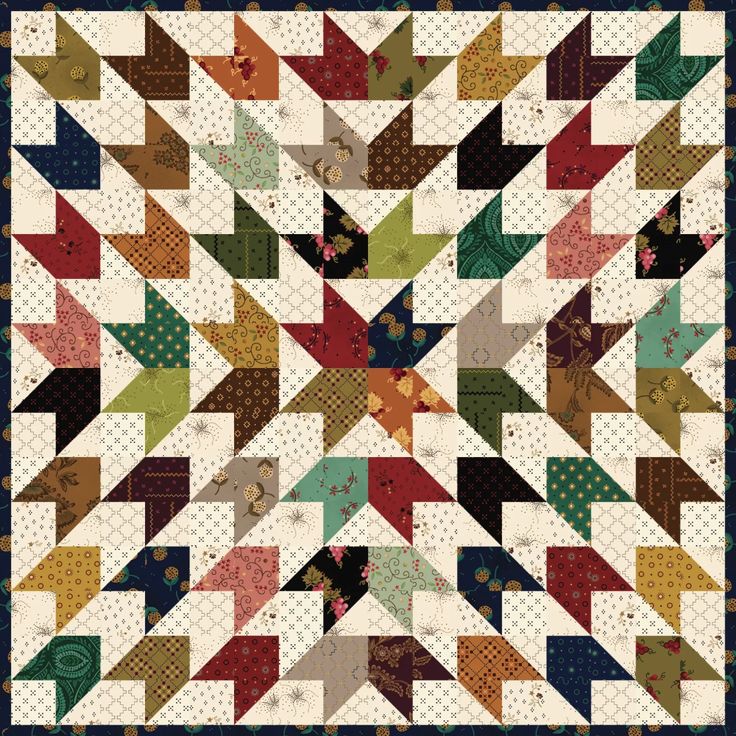 a quilt with many different colors on it