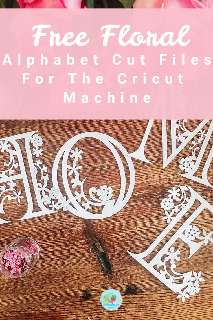 a wooden table topped with cut out letters and pink flowers next to it is the text free floral alphabet cut files for the cricut machine