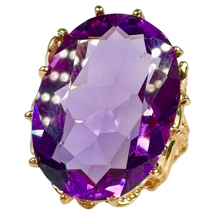 Vintage amethyst cocktail ring in 14KT yellow gold, artistically finished with one of the most brightest color amethyst. Very bright ring for a night out or a gala dinner. GOLD: 14KT gold NATURAL AMETHYST(S) Clarity/Color: Slightly Included/Purple mm: 17X12 OVAL Grams:5.61 size: 8 Item#: 200-00062 ATF WHAT YOU GET AT STAMPAR JEWELERS: Stampar Jewelers, located in the heart of Jupiter, Florida, is a custom jewelry store and studio dedicated to providing 100% satisfaction to each client. Our personal attention to detail, passion, affordability and honesty set us apart from any other store. We will bring full catering of our services to you online through phone calls, consultations and detailed production process. Shopping online can be challenging and we want to help you by providing you wit Amethyst Cocktail Ring, Cocktail Vintage, Jupiter Florida, Gala Dinner, Phone Calls, Pretty Jewelry, Pretty Jewellery, 14kt Gold, Cocktail Ring