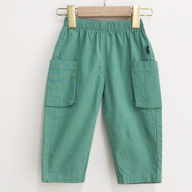 Boys Casual Solid Pocket Trousers Wholesale Boys Clothing Suppliers - PrettyKid Casual Green Bottoms For Playtime, Playful Spring Bottoms With Pockets, Casual Green Playwear Bottoms, Playful Spring Pants, Casual Green Bottoms For Playwear, Playful Spring Pants With Pockets, Green Bottoms With Elastic Waistband For Playwear, Green Cotton Playwear Pants, Green Bottoms With Pockets For Playwear