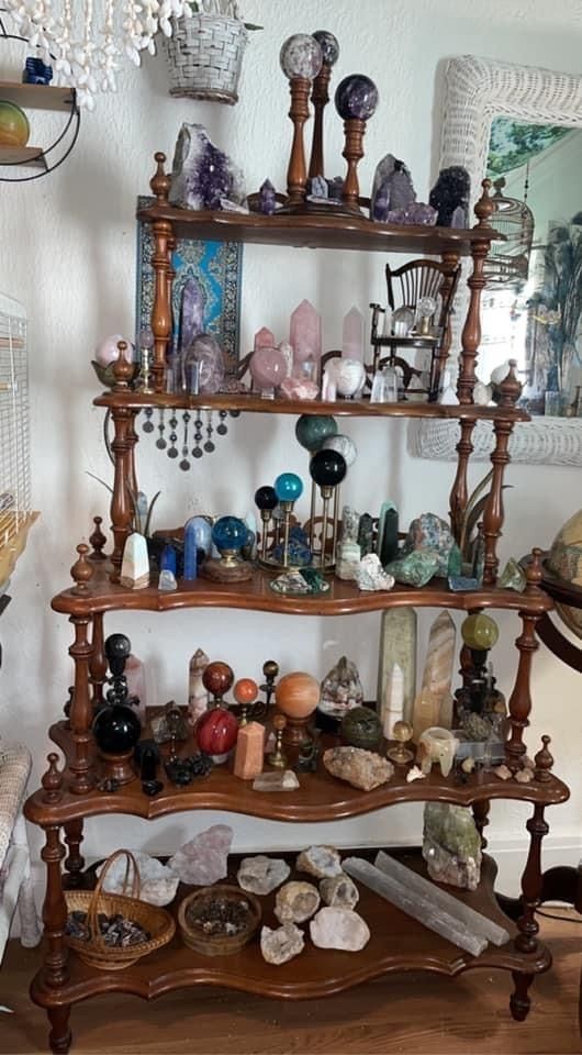 a wooden shelf filled with lots of different items